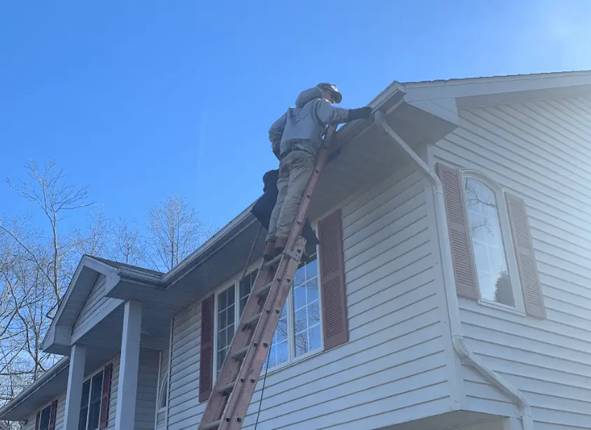 Gutter cleaning and maintenance being performed by Cleveland Heights Power Washing in Cleveland Heights